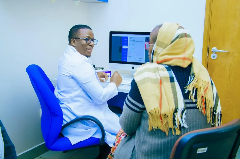 Specialist consulting a patient at the camp